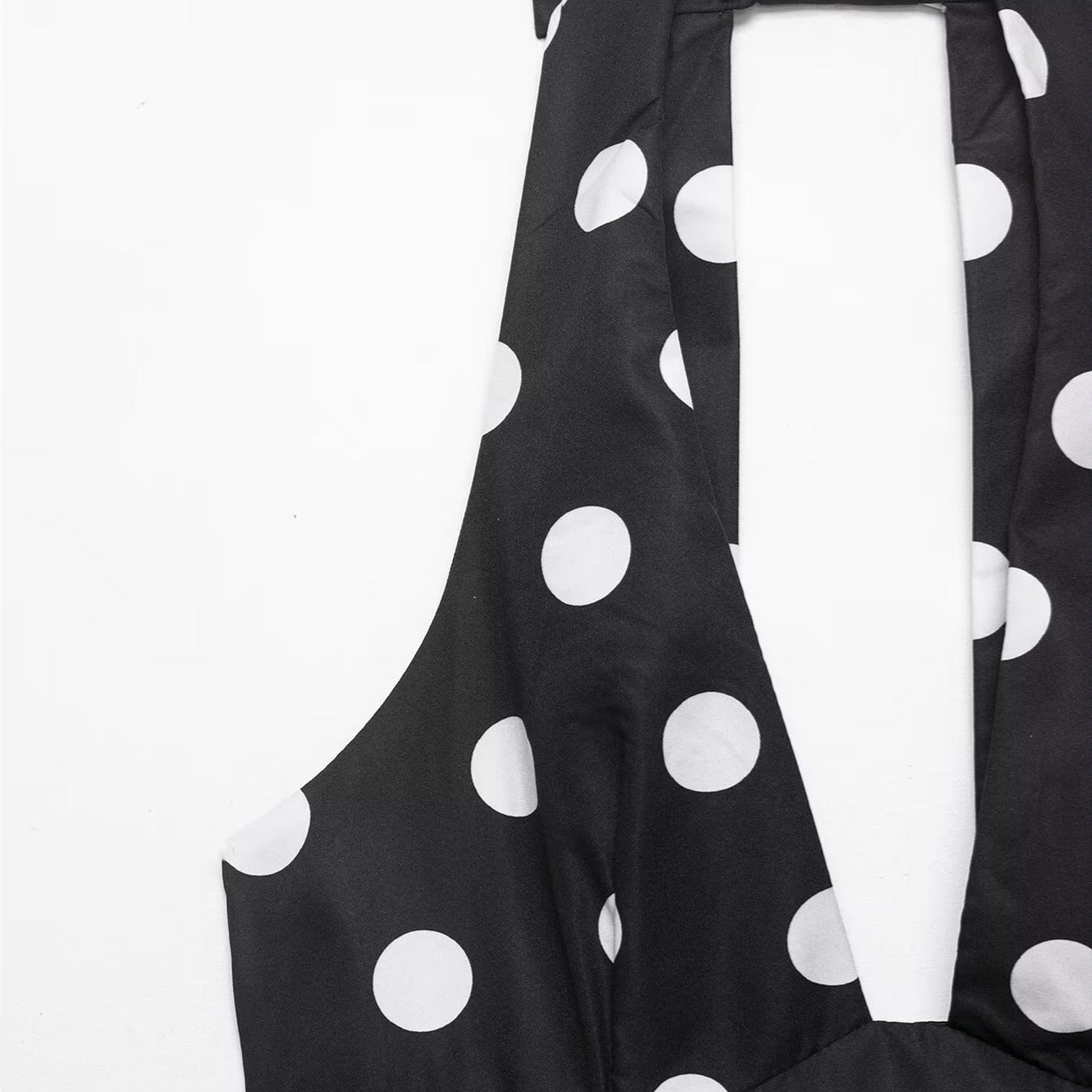 Bow embellished polka dot hanging neck collar sleeveless top